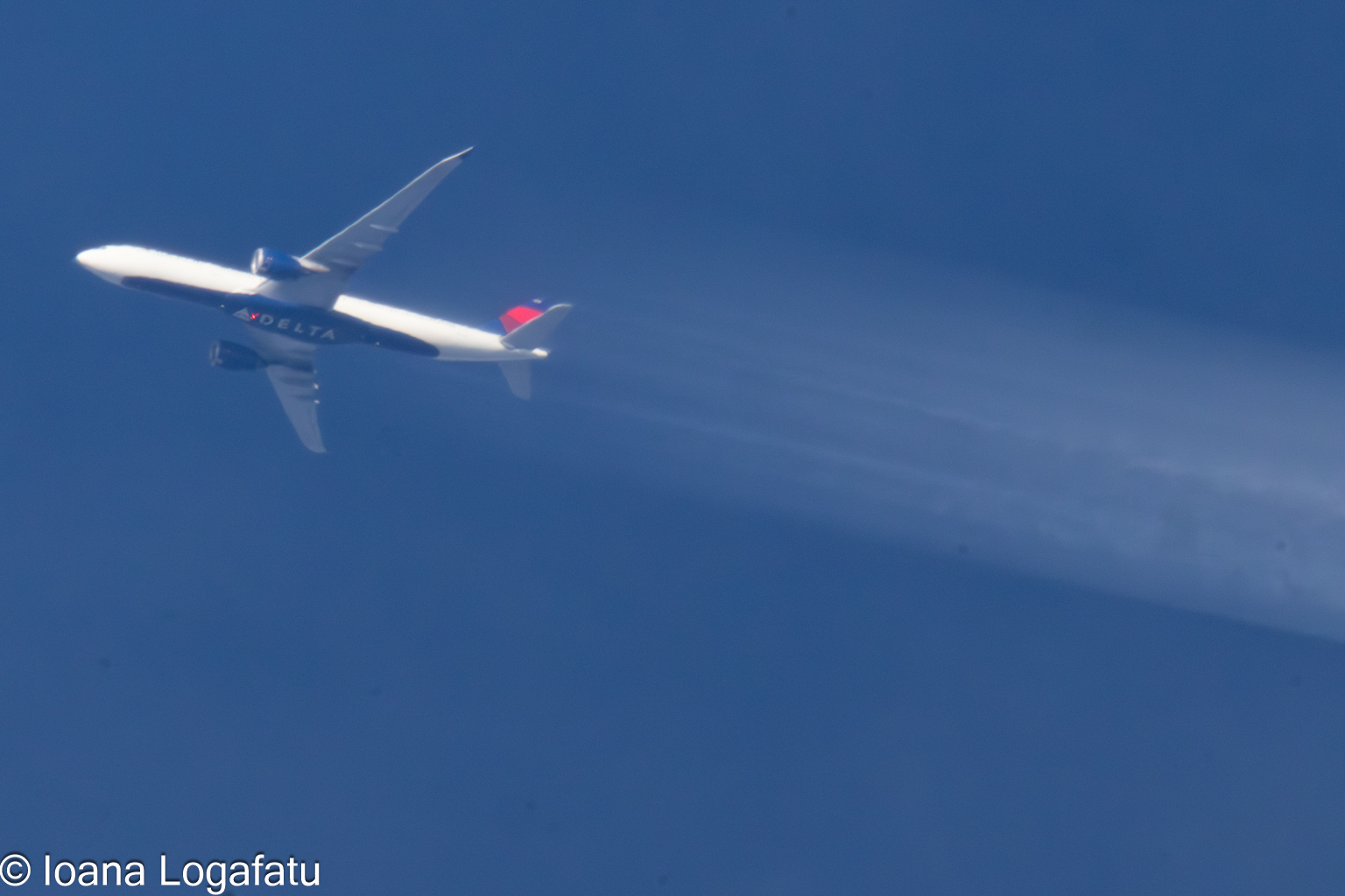 Plane soaring high above the clouds